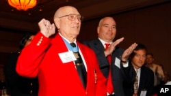 FILE - Medal of Honor recipient Hershel "Woody" Williams, front, reacts as he is introduced during the 2012 Medal of Honor luncheon in Atlanta, May 11, 2012.