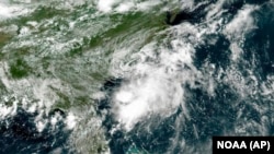 This GOES-East geocolor image provided by NOAA and taken at 11:30 a.m., July 2, 2022, shows Tropical Storm Colin of the Atlantic coast of the United States. 