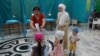 Voters cast their ballots at a polling station during a nationwide referendum in Nur-Sultan, Kazakhstan, June 5, 2022. 