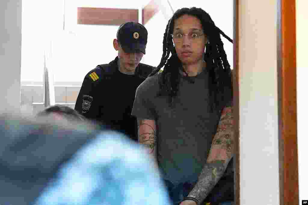 WNBA star and two-time Olympic gold medalist Brittney Griner is escorted to a courtroom for a hearing, in Khimki just outside Moscow, Russia.