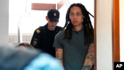 WNBA star and two-time Olympic gold medalist Brittney Griner is escorted to a courtroom for a hearing, in Khimki just outside Moscow, Russia, June 27, 2022.