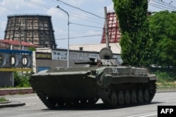 A Ukrainian armored fighting vehicle drives down a street in Kramatorsk, eastern Ukraine, on July 6, 2022.