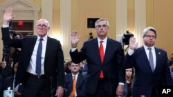 FILE - From left, Rusty Bowers, Arizona House speaker, Brad Raffensperger, Georgia secretary of state, and Gabe Sterling, Georgia deputy secretary of state, are sworn in during a House committee's probe of the Jan. 6, 2021, attack on the U.S. Capitol, June 21, 2022.