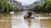 气候变化导致全球高温及洪水，中国电力短缺，南方洪灾严重