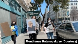 Monthanus Ratanapakdee holds a photo of her father, Vicha Ratanapakdee during an Anti Asian Hate rally in San Francisco, CA, Jan 13, 2022.