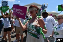 Abortion rights activists protest outside the Supreme Court on the last day of their term on June 30, 2022 in Washington.