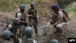 Servicemen of the 126th Separate Territorial Brigade of the Armed Forces of Ukraine take part in military exercises in the Odessa region, June 22, 2022, amid Russia's military invasion.