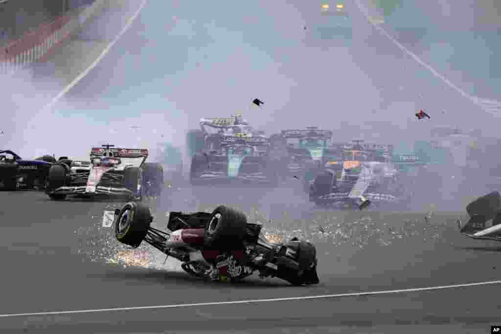 Alfa Romeo driver Guanyu Zhou of China crashes at the start of the British Formula One Grand Prix at the Silverstone circuit, in Silverstone, England.