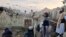 Nan foto sa a ke ajans nouvel leta Bakhtar pibliye, Afghan yo gade destriksyon yon tranbleman te nan pwovens Paktika, nan les peyi a, Mekredi, 22 Jyen, 2022. 