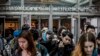 FILE - Students at Stuyvesant High School leave after classes end for the week, March 13, 2020, in New York. 