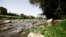 Italy's historic River Tiber is seen with low water levels near Ponte Milvio, in Rome, June 21, 2022.