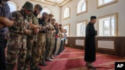 Former Mufti Sheikh Said Ismahilov, leads Muslim soldiers defending Ukraine against Russian aggression during prayers on the first day of Eid al-Adha, at Medina Mosque, in Konstianynivka, eastern Ukraine, July 9, 2022. 