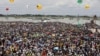 A crowd watches the opening of Bangladesh's longest bridge, which took eight years to build on the Padma River on the outskirts of Dhaka, Bangladesh, June 25, 2022.