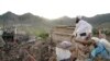 A man stands among destruction after an earthquake in Gayan village, in Paktika province, Afghanistan, June 23, 2022.