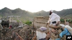 A man stands among destruction after an earthquake in Gayan village, in Paktika province, Afghanistan, June 23, 2022.