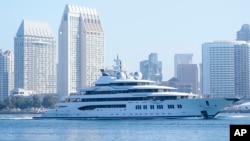 The super yacht 'Amadea' passes San Diego as it comes into the San Diego Bay, seen from Coronado, Calif., June 27, 2022. The $325 million superyacht was seized by the United States from a sanctioned Russian oligarch.