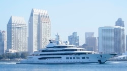 FILE - The superyacht Amadea passes San Diego as it comes into the San Diego Bay, seen from Coronado, California, June 27, 2022. The $325 million superyacht was seized by the United States from a sanctioned Russian oligarch.