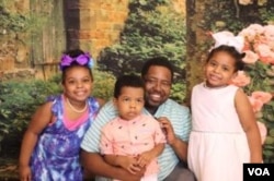 Robert Sensley, program assistant for Louisiana Black Advocates for Life, with his three children.