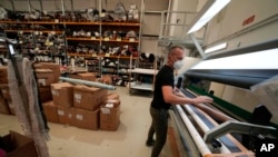 A worker checks the quality of textiles from the D. Exterior production at the Cose di Maglia factory, in Brescia, Italy, on June 14, 2022.