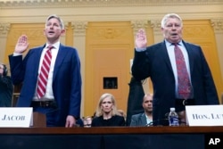Greg Jacob, who was counsel to former Vice President Mike Pence, left, and Michael Luttig, a retired federal judge, are sworn in to testify as the House select committee investigating the January 6, 2021, attack on the Capitol holds a hearing at the Capit