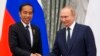 Russian President Vladimir Putin, right, and Indonesian President Joko Widodo shake hands after a joint news conference after their meeting in the Kremlin in Moscow, June 30, 2022.