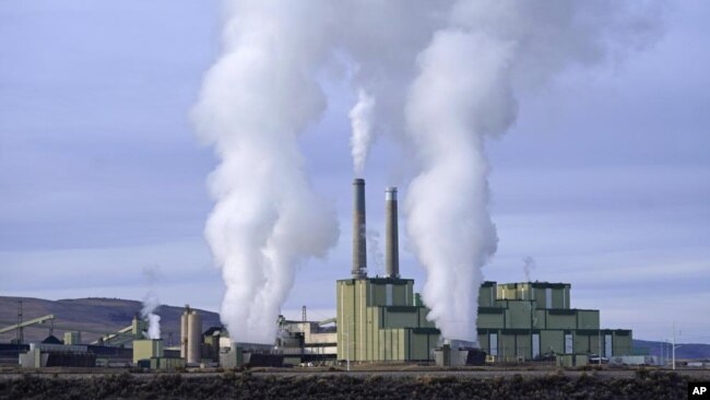 FILE - Steam billows from a coal-fired power plant Nov. 18, 2021, in Craig, Colo. The Supreme Court on Thursday, June 30, 2022, limited how the nation’s main anti-air pollution law can be used to reduce carbon dioxide emissions from power plants. (AP Photo/Rick Bowmer, File)