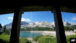 A view of the Marmolada mountain and the Punta Rocca glacier near Canazei, in the Italian Alps in northern Italy, July 6, 2022, where an avalanche broke loose on Sunday, sending tons of ice, snow, and rocks onto hikers. 