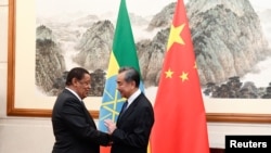 FILE - Chinese Foreign Minister Wang Yi speaks during a meeting with Former Ethiopian President Mulatu Teshome at the Diaoyutai State Guesthouse in Beijing, Oct. 30, 2019. (Madoka Ikegami/Pool via Reuters)