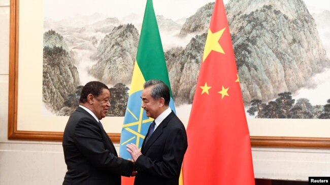 FILE - Chinese Foreign Minister Wang Yi speaks during a meeting with Former Ethiopian President Mulatu Teshome at the Diaoyutai State Guesthouse in Beijing, Oct. 30, 2019. (Madoka Ikegami/Pool via Reuters)