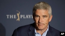 FILE - PGA Tour Commissioner Jay Monahan reacts during a news conference at The Players Championship in Florida on March 13, 2020. People who spoke with news outlets after meeting with Monahan on Tuesday said next year's tour could include purses of at least $20 million.