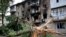 A view of an apartment building damaged during shelling in Donetsk, in territory controlled by the Russia-backed self-proclaimed Donetsk People's Republic, eastern Ukraine, June 22, 2022. 