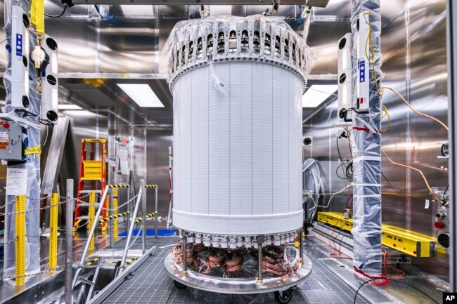 This photo provided by Sanford Underground Research Facility shows the LZ central detector in the clean room at Sanford Underground Research Facility after assembly, before beginning its journey underground in Lead, S.D. (Matthew Kapust/Sanford Underground Research Facility via AP)