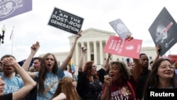 Anti-abortion demonstrators celebrate outside the United States Supreme Court as the court rules in the Dobbs v Women's Health Organization abortion case, overturning the landmark Roe v Wade abortion decision in Washington, U.S., June 24, 2022. 