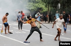 FILE - Police use tear gas to disperse protesters demanding President Gotabaya Rajapaksa step down, amid the country's ongoing economic crisis, in Colombo, Sri Lanka, May 29, 2022.
