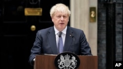 British Prime Minister Boris Johnson speaks to media next to 10 Downing Street in London, Thursday, July 7, 2022. (AP Photo/Alberto Pezzali)