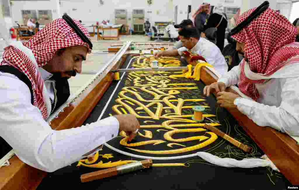 Workers prepare the Kiswa, a silk cloth that covers the Kaaba, the sacred building at the center of the Grand Mosque, ahead of the annual haj pilgrimage, at a factory in the holy city of Mecca, Saudi Arabia.