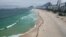 FILE - People create a line along Copacabana beach for a symbolic group hug with the sea on World Oceans Day in Rio de Janeiro, Brazil, June 8, 2022.