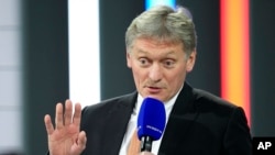 FILE - Kremlin spokesman Dmitry Peskov speaks to journalists in Moscow, Russia, Dec. 23, 2021.