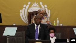 FILE - South African President Cyril Ramaphosa addresses parliament in Cape Town, South Africa, Thursday, June 9, 2022. 