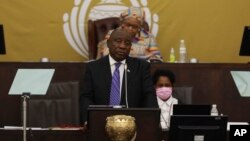 FILE: South African President Cyril Ramaphosa at parliament in Cape Town, South Africa, on June 9, 2022. Ramaphosa faces claims that he tried to cover up the theft of millions of dollars in U.S. currency that was hidden inside furniture at his game farm. 
