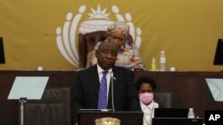 FILE - South African President Cyril Ramaphosa addresses parliament in Cape Town, South Africa, Thursday, June 9, 2022. Ramaphosa could face criminal charges over claims that he tried to cover up the alleged theft of millions of dollars hidden inside furniture at his game farm.