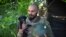 A Ukrainian soldier and his puppy, in the Donetsk region, Ukraine, July 2, 2022. 