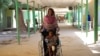 FILE - A woman brings her 7-year-old granddaughter for treatment at the Dubti referral hospital, Afar region, Ethiopia, Feb. 24, 2022.
