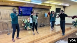 Members of the Lighthouse Christian Fellowship Church congregation perform during Sunday service on June 26, 2022. Trinity Wicker is in the back row on the right.