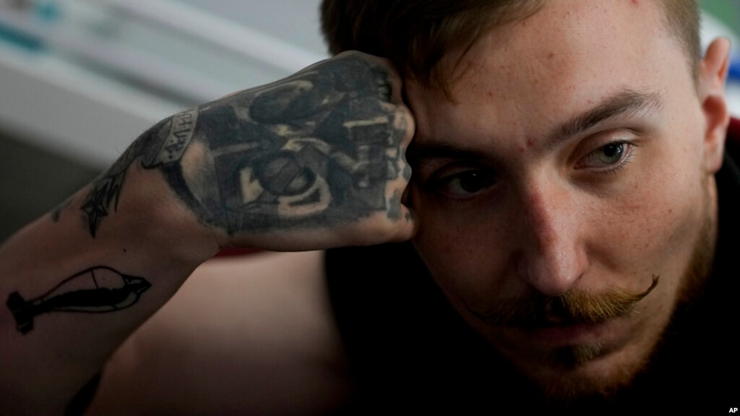 Vladislav Zahorodnii looks on during an interview with The Associated Press at a clinic in Kyiv, Ukraine, Friday, June 17, 2022. Zahorodnii was evacuated from Azovstal by helicopter on March 31, after three failed earlier attempts.