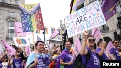 People attend the 2022 Pride Parade in London, July 2, 2022.