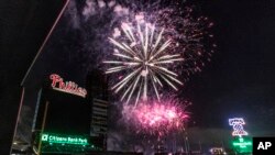 Fireworks erupt in celebration of the Independence Day holiday over Citizens Bank Park after a baseball game between Philadelphia Phillies and St. Louis Cardinals, Sunday, July 3, 2022, in Philadelphia. (AP Photo/Laurence Kesterson)