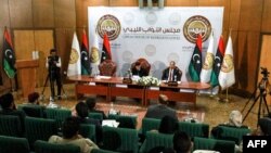 FILE - Aguila Saleh, speaker of the Tobruk-based Libyan House of Representatives, chairs a session with other representatives in the eastern Libyan city of Benghazi, Dec. 7, 2020. 