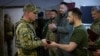 Ukraine's President Volodymyr Zelenskiy awards a Ukrainian serviceman at a position, as Russia's attack on Ukraine continues, outside the southern city of Mykolaiv, Ukraine June 18, 2022.