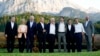 Members of the Group of Seven, including European Union leaders, pose for a photo at Schloss Elmau, following dinner, in Elmau, Germany, June 26, 2022. 